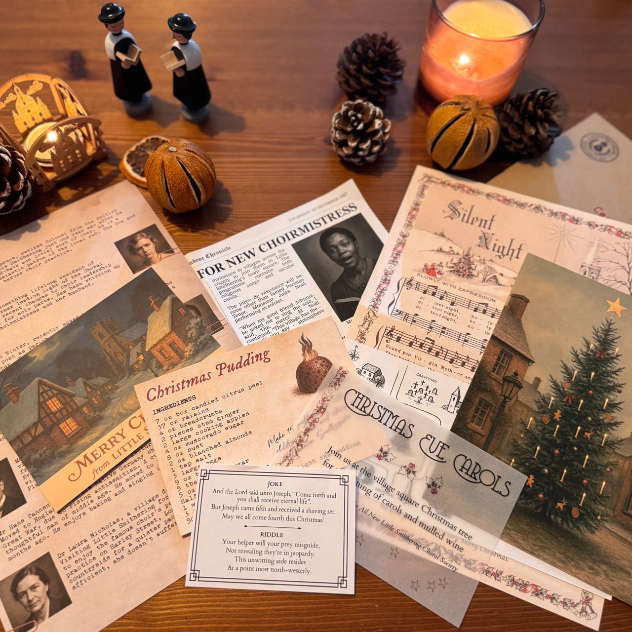 Vintage Christmas-themed murder mystery game including cards, decorations, and a candle on a wooden surface.
