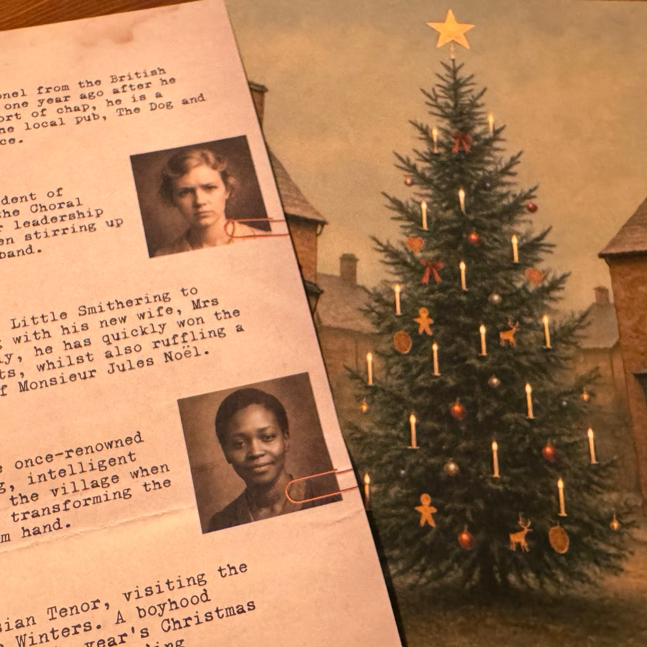 Murder mystery game. Christmas tree with ornaments and a police report clipping featuring two portraits.