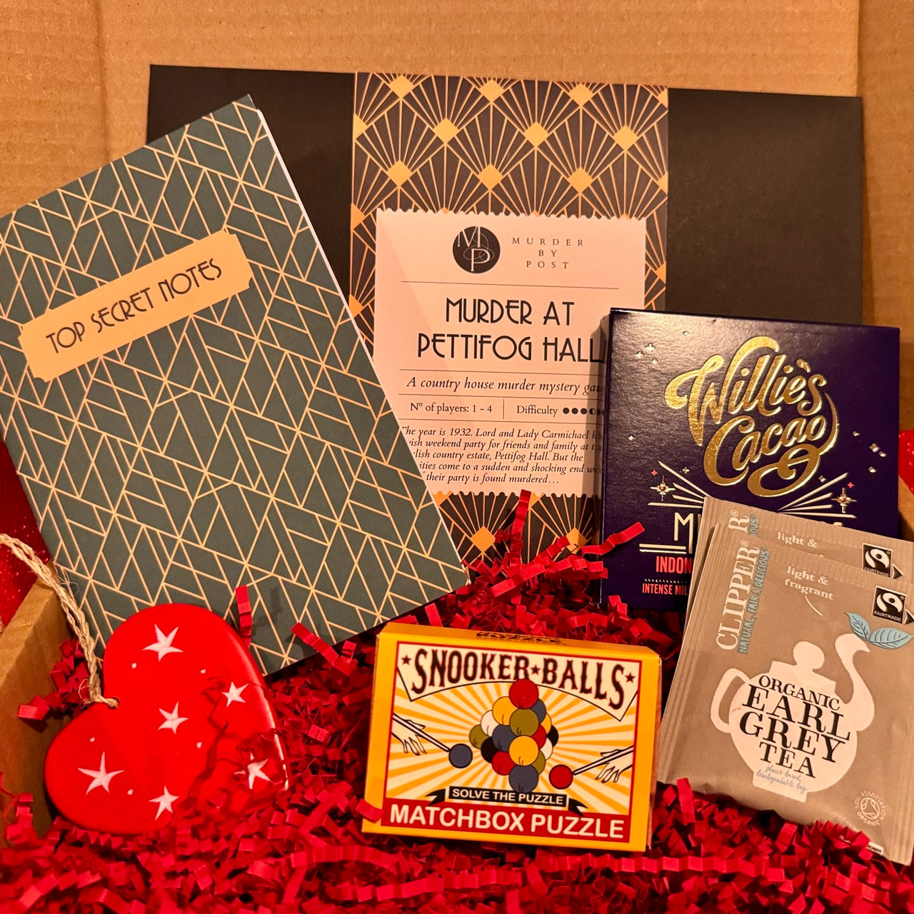 Collection of items included in Partner in Crime Gift Box