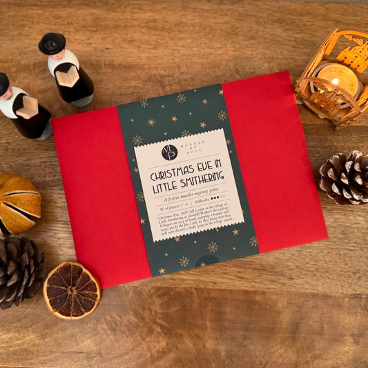 Murder mystery game titled 'Christmas Eve in Little Smithering' on a wooden surface with decorative items.